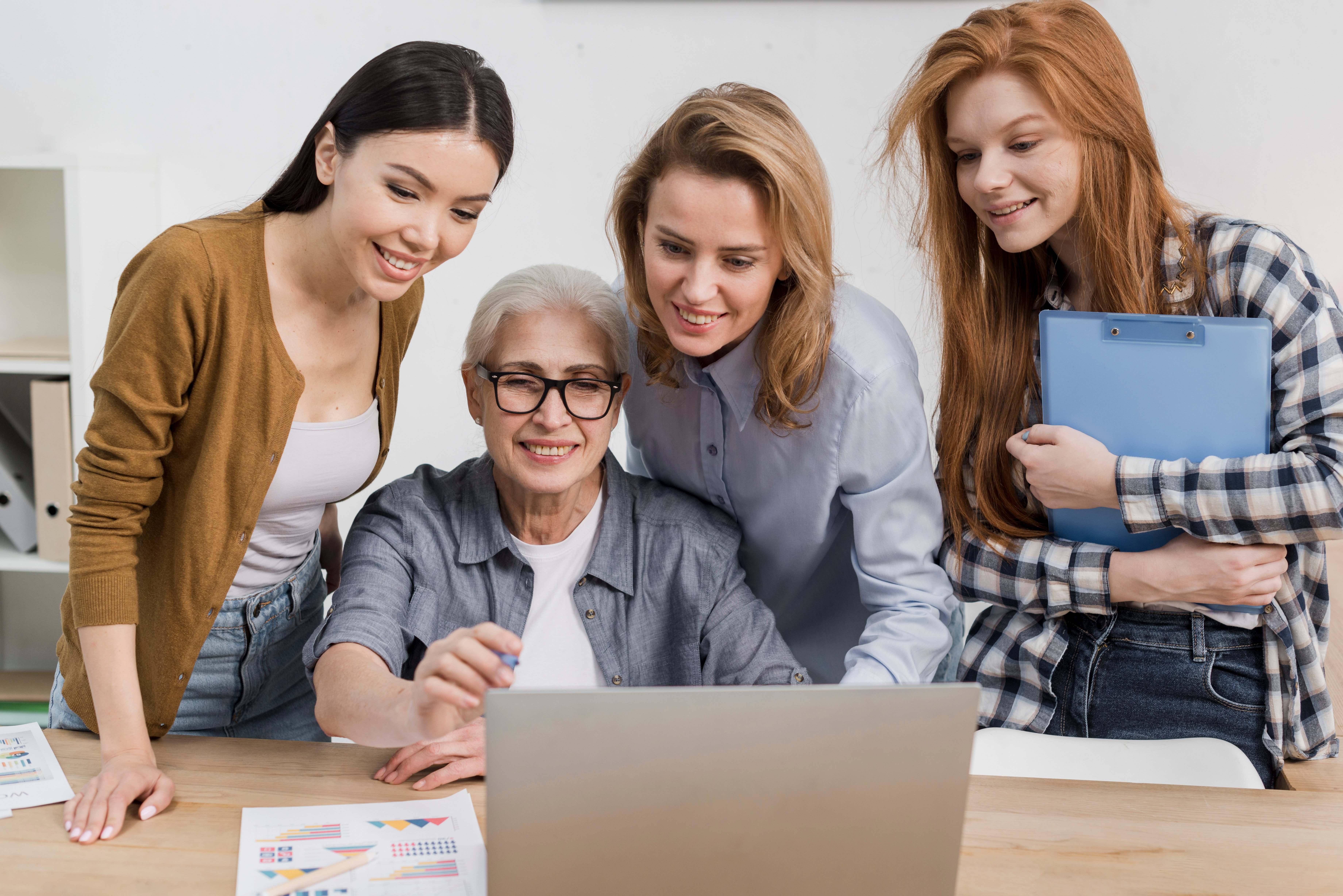 group-females-working-together-laptop